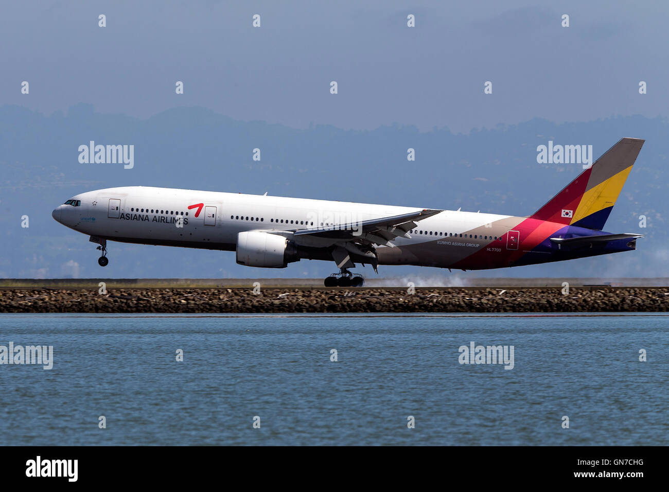 Asiana Airlines Boeing 777-28EER (HL7700) lands at San Francisco International Airport (SFO), Millbrae, California, United States of America Stock Photo