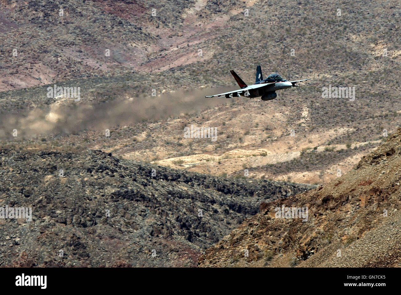 US Navy Boeing F/A-18F Super Hornet NH-100 (SN 166873) from VFA-154 the 'Black Knights' flies through the Jedi Transition, R-2508 complex, Star Wars Canyon / Rainbow Canyon, Death Valley National Park, California, United States of America. Stock Photo
