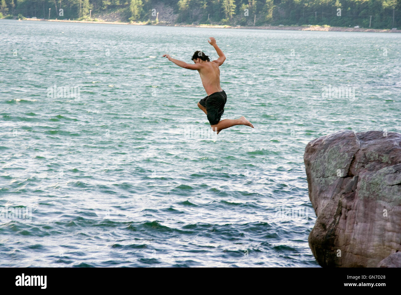 Devil's Lake State Park. Kid is jumping in the water. Stock Photo