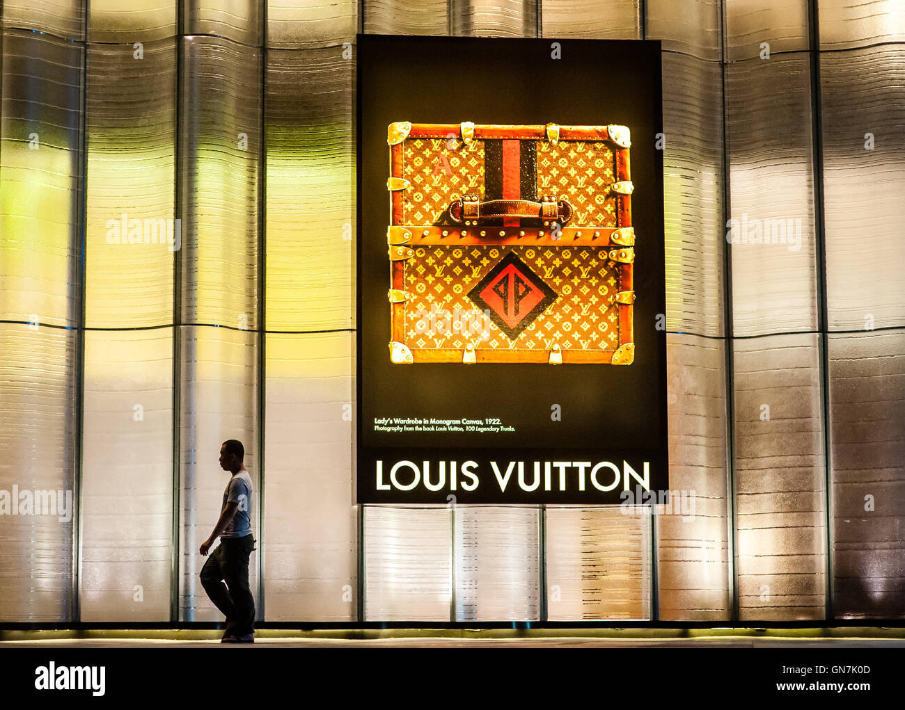 Man walking by Louis Vuitton Billboard Stock Photo - Alamy