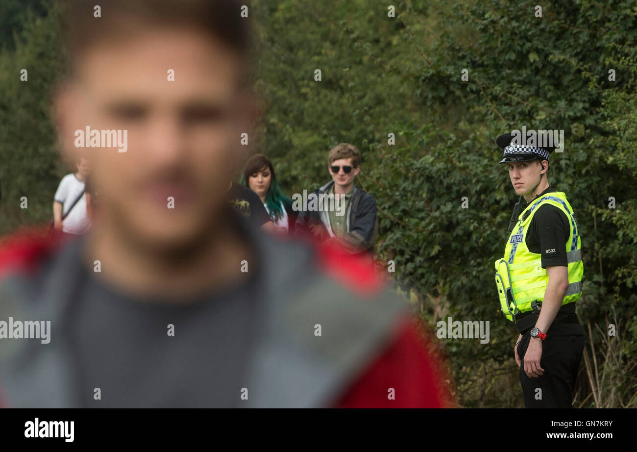 Festivalgoers arrive at Leeds Festival at Bramham Park, West Yorkshire, after two teenagers