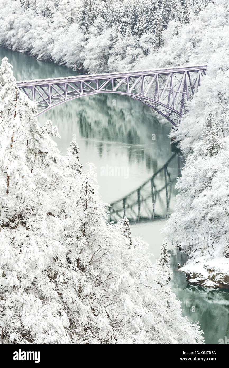 Winter landscape snow covered trees with River and Bridge Stock Photo ...