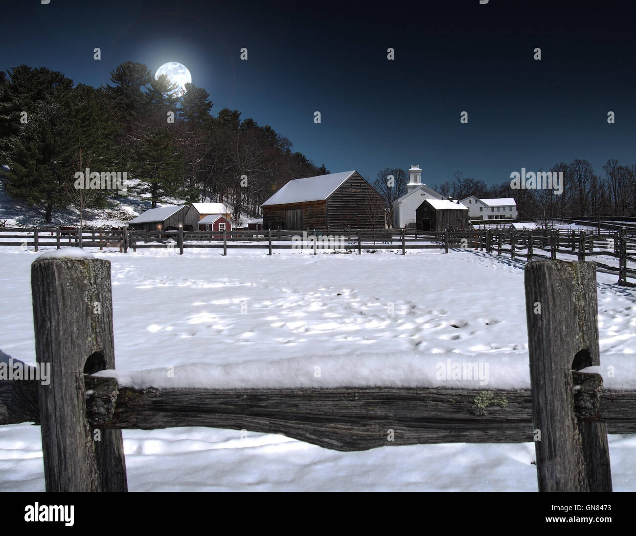 view of a farming community at nighttime in the winter Stock Photo