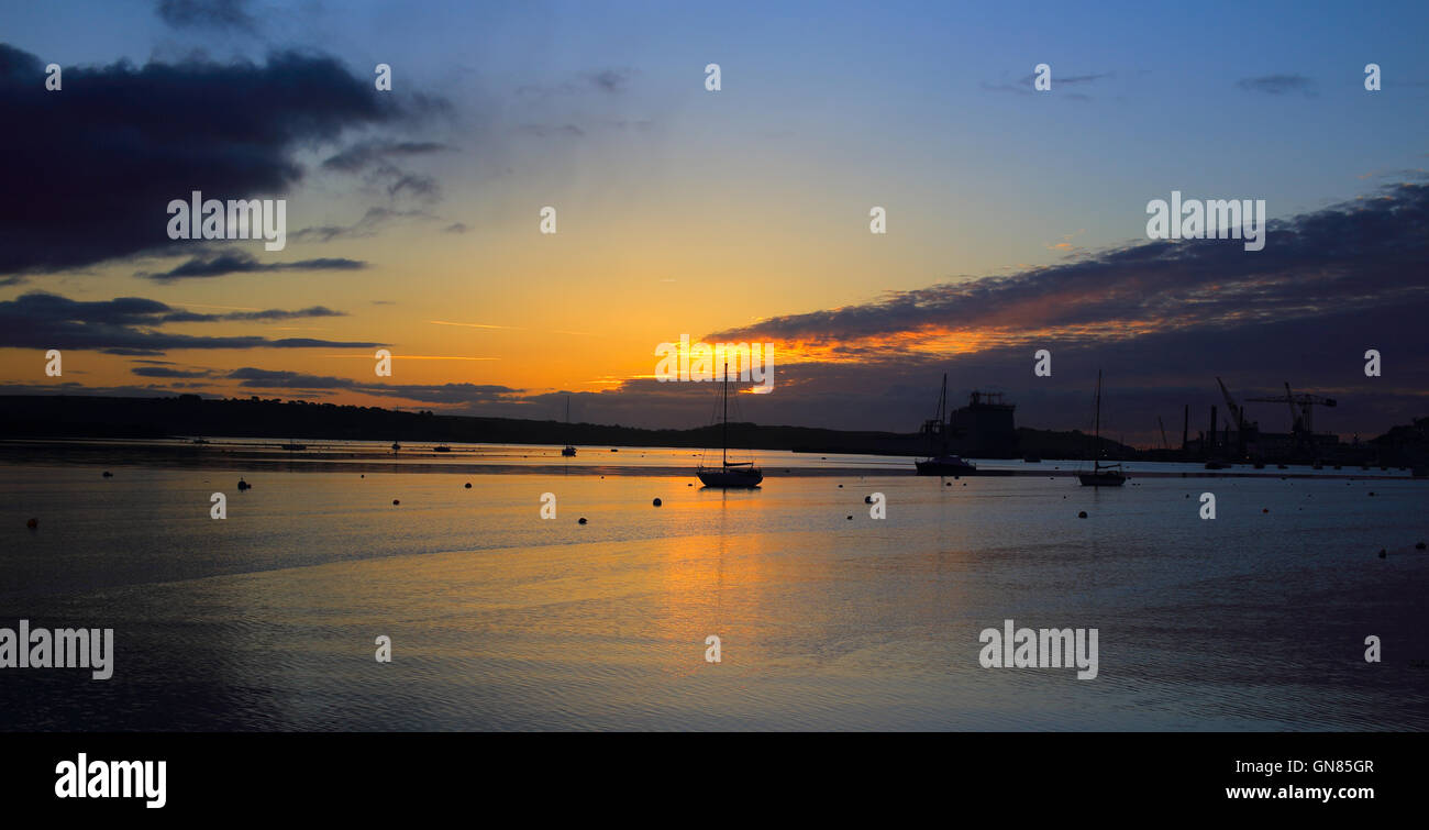 Sunrise over the Carrick Roads at high tide, Falmouth, Cornwall, England, UK. Stock Photo