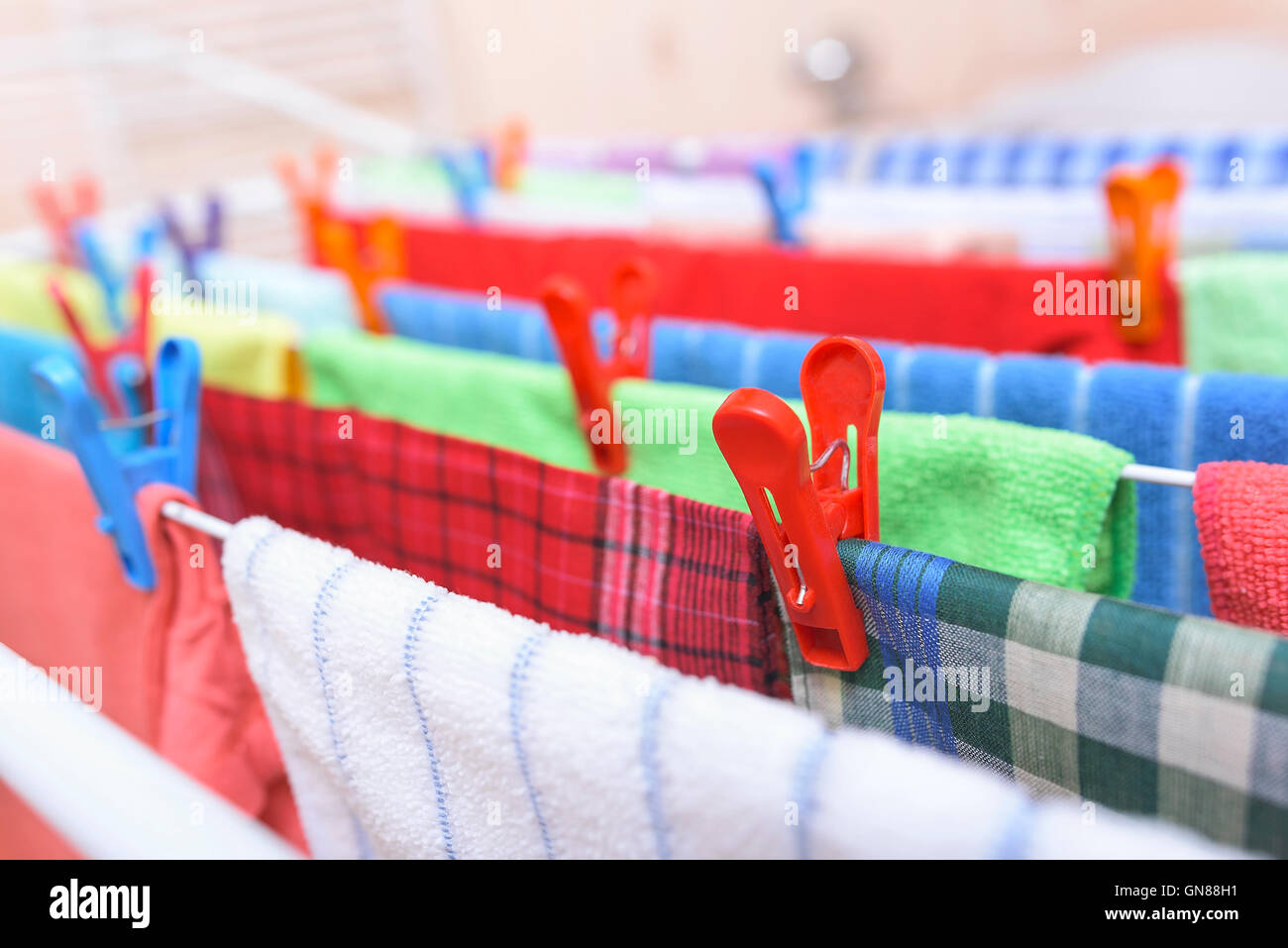 Beautiful multicolored clothes drying in the dryer Stock Photo Alamy