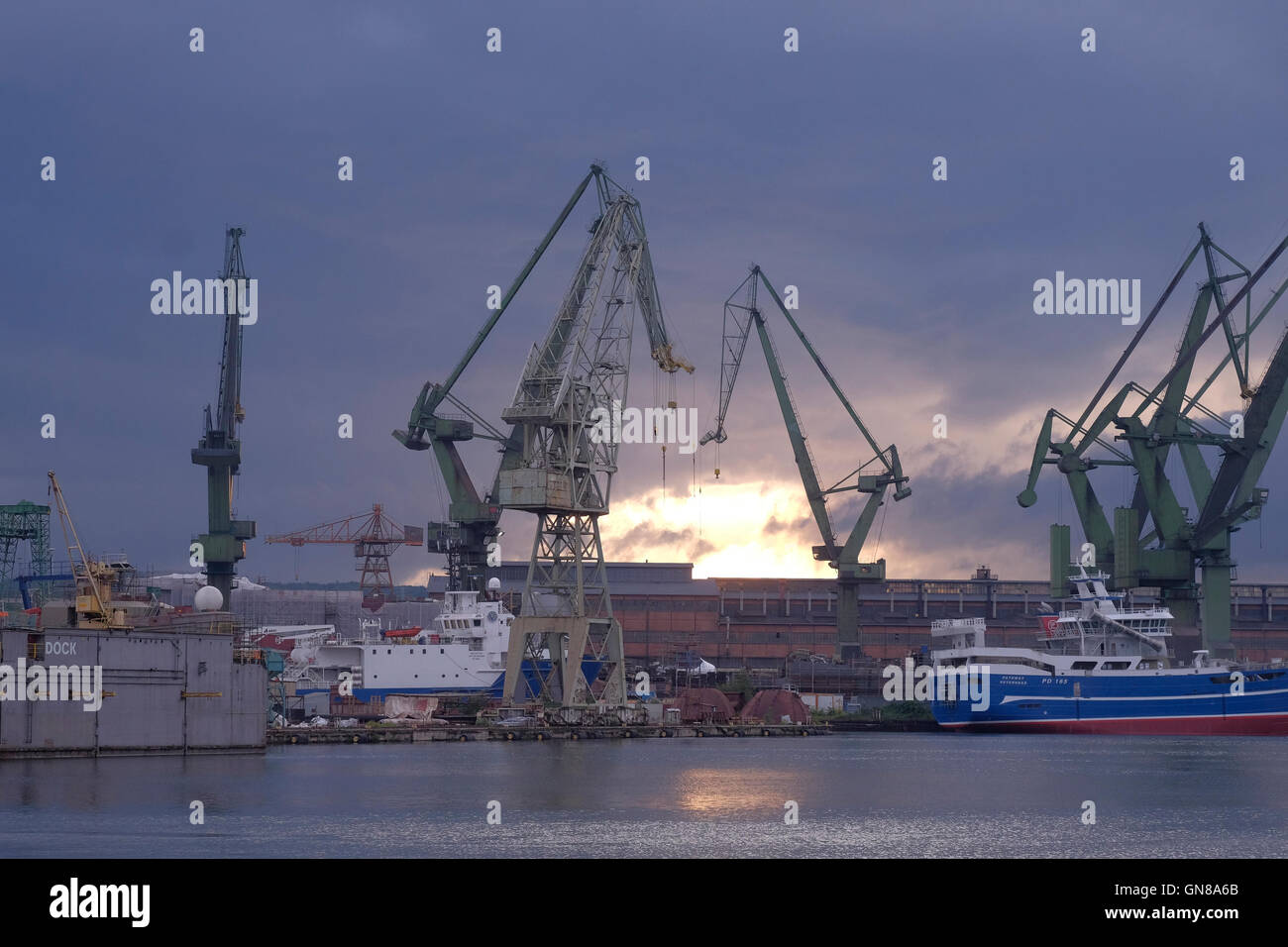 View of massive cranes of the shipyard in the city of Gdansk northern Poland Stock Photo