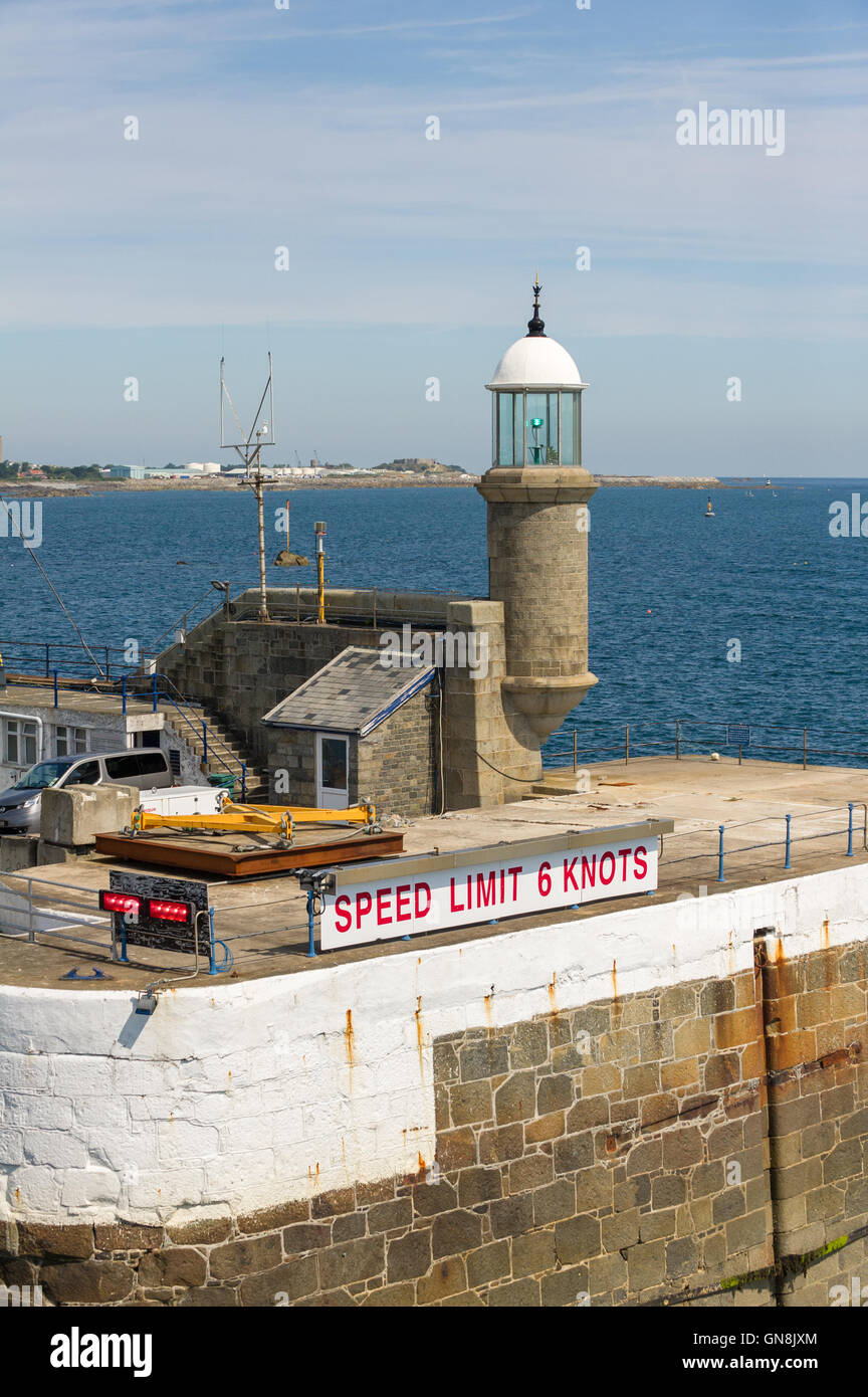 Stone build lighthouse at the entrance to Saint Peter port, Guernsey. Stock Photo