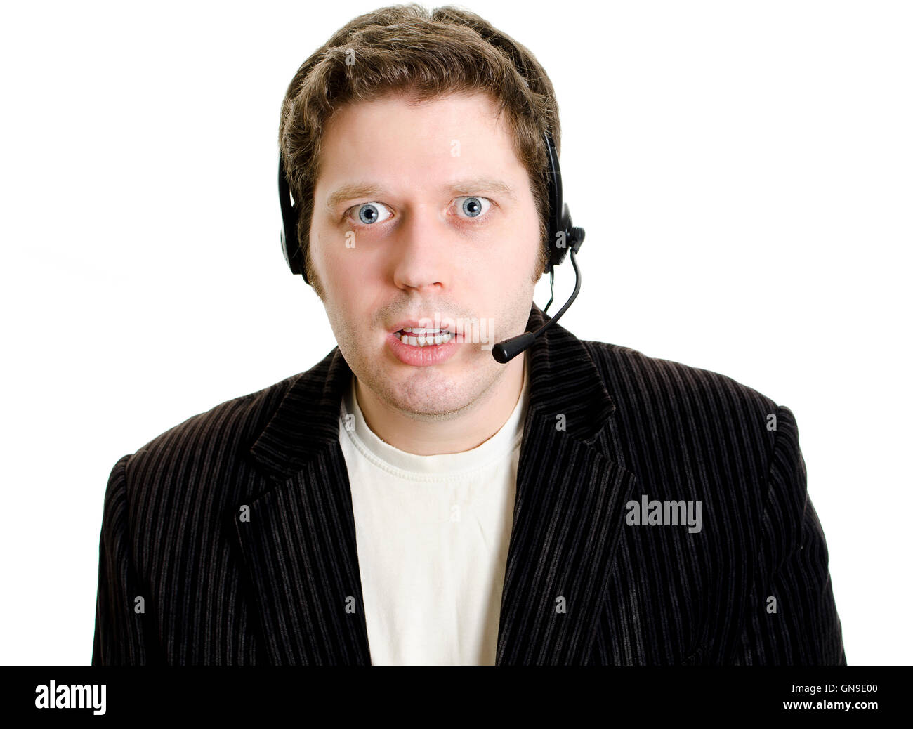 Sports commentator or Customer support with headphones in shock. Isolated on white. Stock Photo