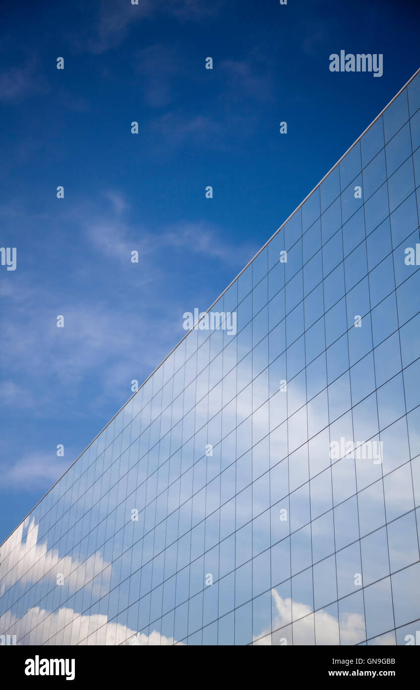 Office building and blue sky reflection Stock Photo - Alamy