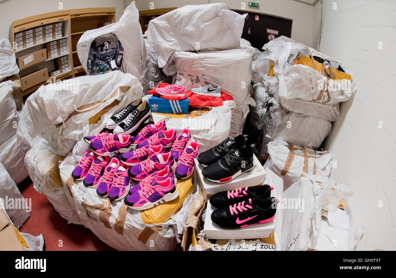 Hannover, Germany. 16th Aug, 2016. Confiscated, fake branded goods in the  design of Adidas, Nike and Converse lie at the chief customs office in  Hannover, Germany, 16 August 2016. Photo: Julian Stratenschulte/dpa/Alamy