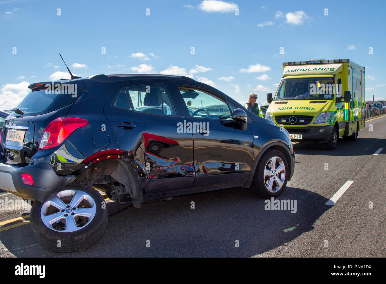 Southport, Merseyside, UK. 29th August, 2016.  Bank Holiday Mayhem as roads are closed after serious accident. One of the main roads into the town was closed after a high impact, virtually head on crash involving two vehicles, a Mazda MX5 and a Vauxhall Mokka exclusive s/s. Police and several ambulances attended on what is busy day for the emergency services. Long tailbacks into the town were caused as a result of road closures. Credit:  MediaWorldImages/Alamy Live News Stock Photo