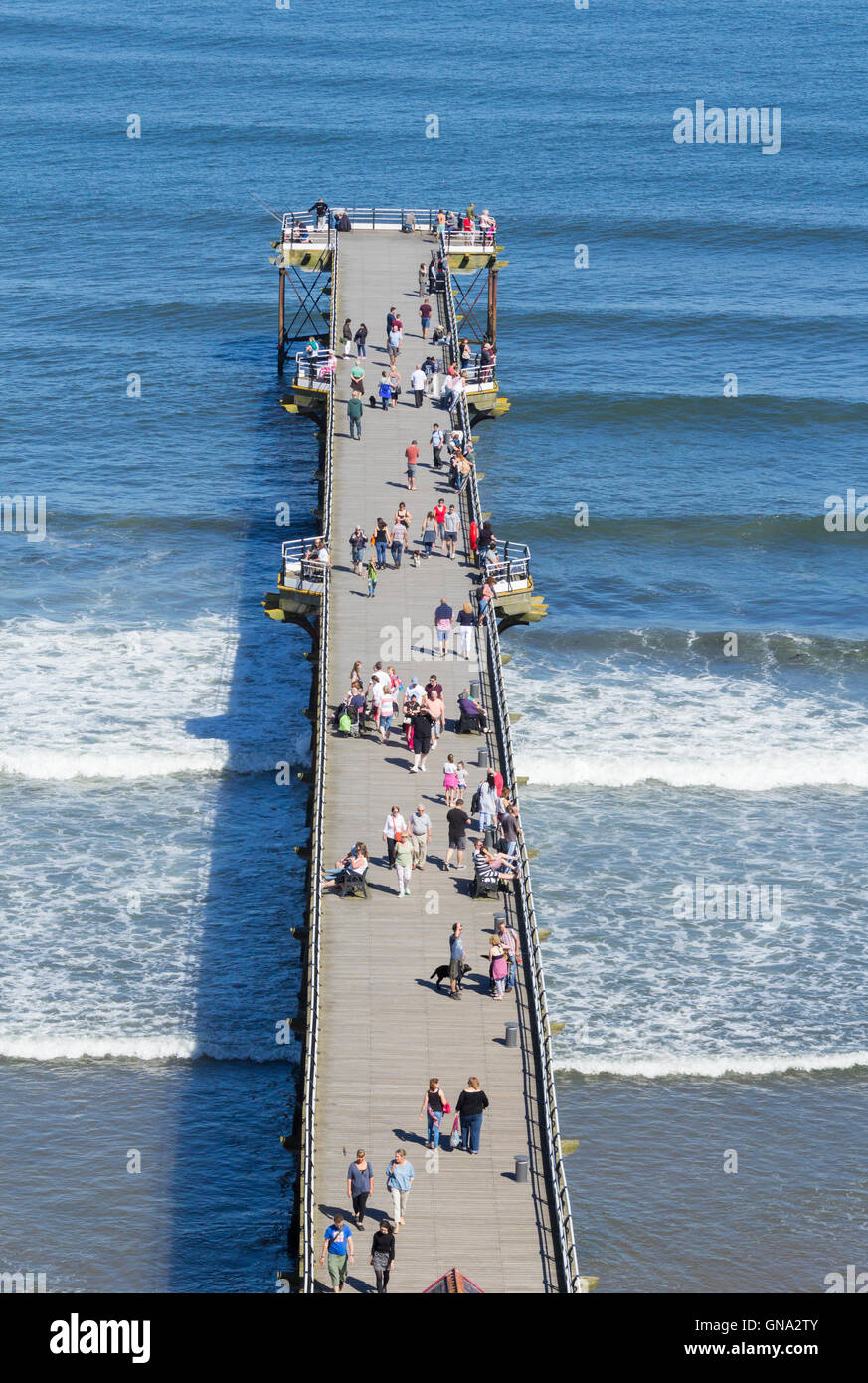 Saltburn by the sea, England, UK. 29th Aug, 2016. Weather: Glorious Bank holiday Monday weather at Saltburn by the sea, North Yorkshire. PICTURED: View over Saltburn`s Victorian pier from top promenade. Credit:  Alan Dawson News/Alamy Live News Stock Photo