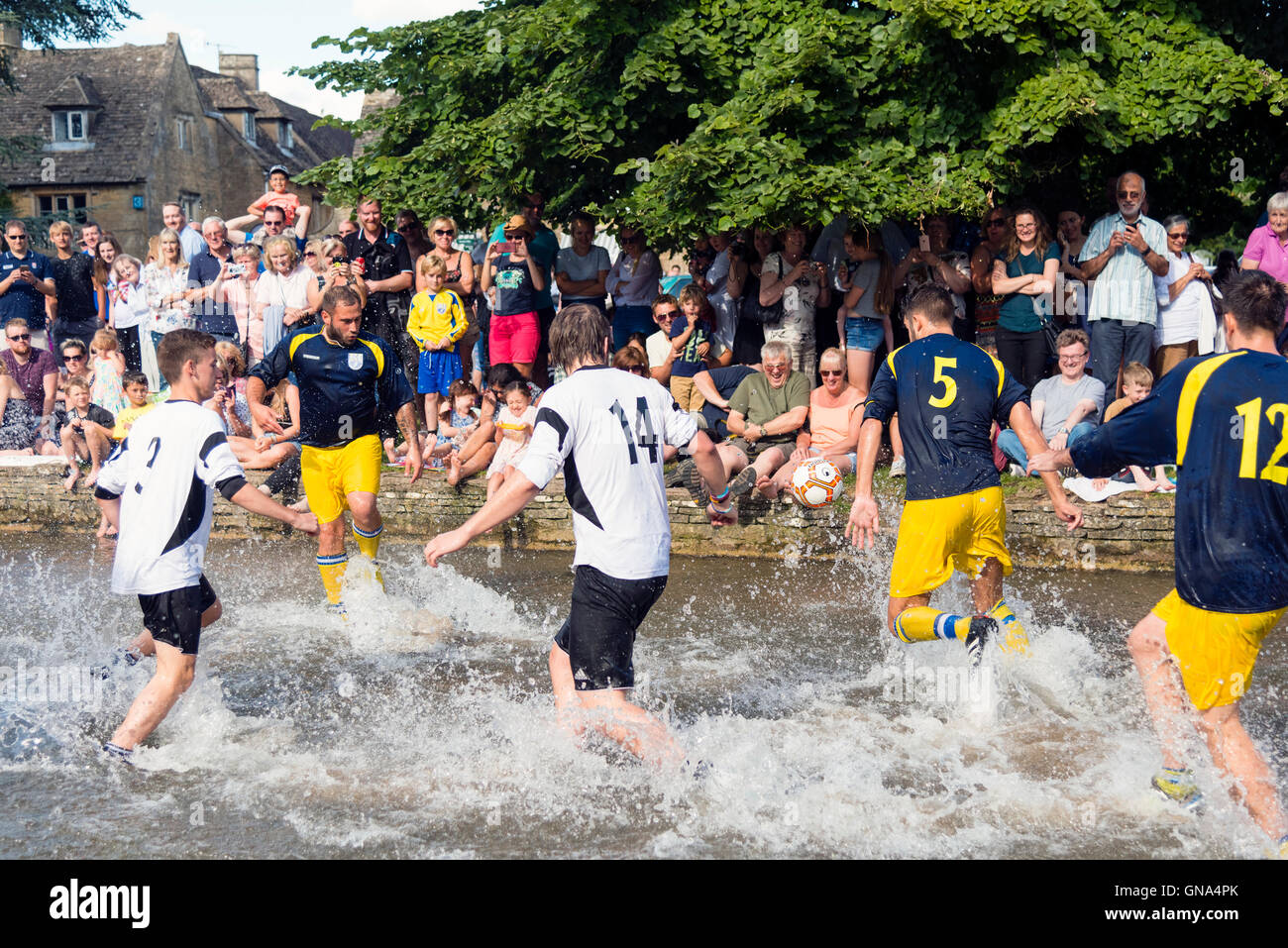 Cotswolds, UK. 29th August, 2016. Bourton-on-the-Water Football in the River Windrush, August Bank Holiday Monday, Cotswolds, UK. Credit:  Robert Convery/Alamy Live News Stock Photo