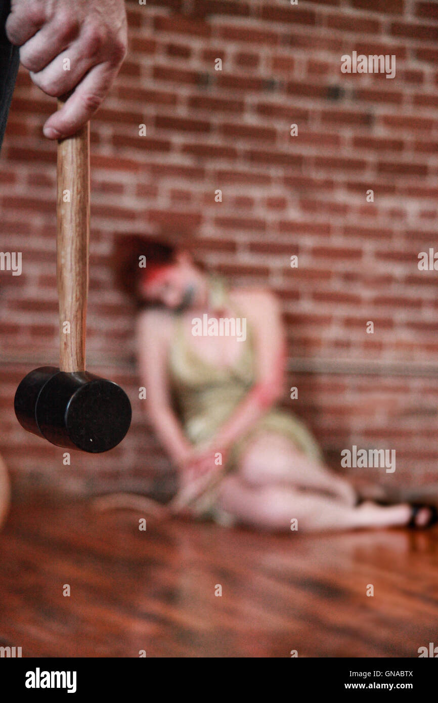 Crime Scene of a Perpetrator Holding Murder Weapon Stock Photo