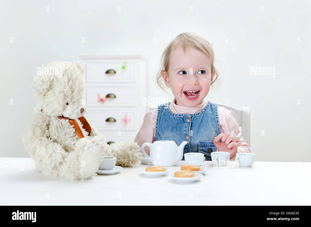 Child drink tea with bagels Stock Photo Alamy