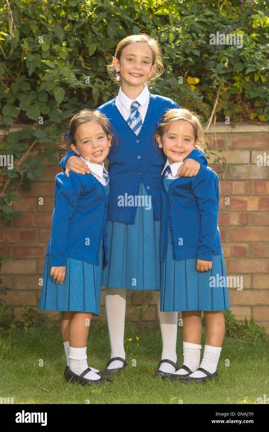 Embargoed to 0001 Tuesday August 30 Rosie (left) and Ruby Formosa, from London, with their elder sister Lily (centre). The twins, who were born joined at the abdomen and shared part of the intestine, are due to start school in September. Stock Photo