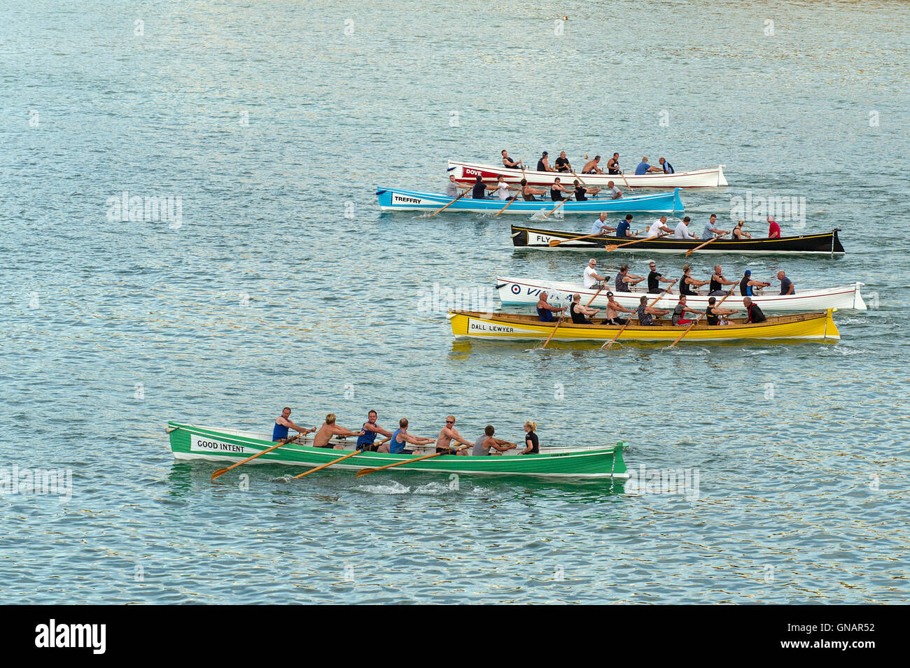 Traditional Cornish Pilot Gigs at the start of a race in Newquay, Cornwall. Stock Photo