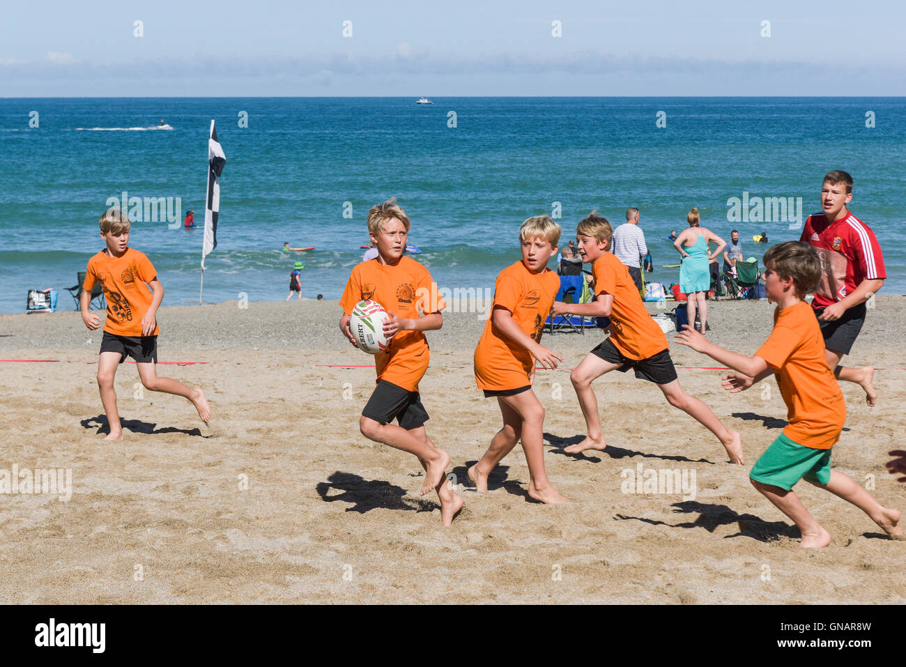 The annual Lusty Glaze Beach Tag Rugby tournament in Newquay, Cornwall. Stock Photo