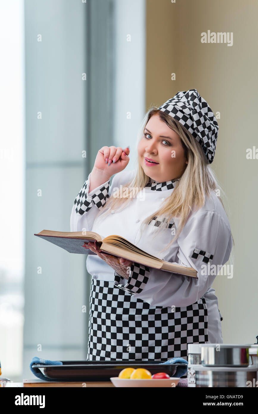 Young chef cook working in the kitchen Stock Photo - Alamy