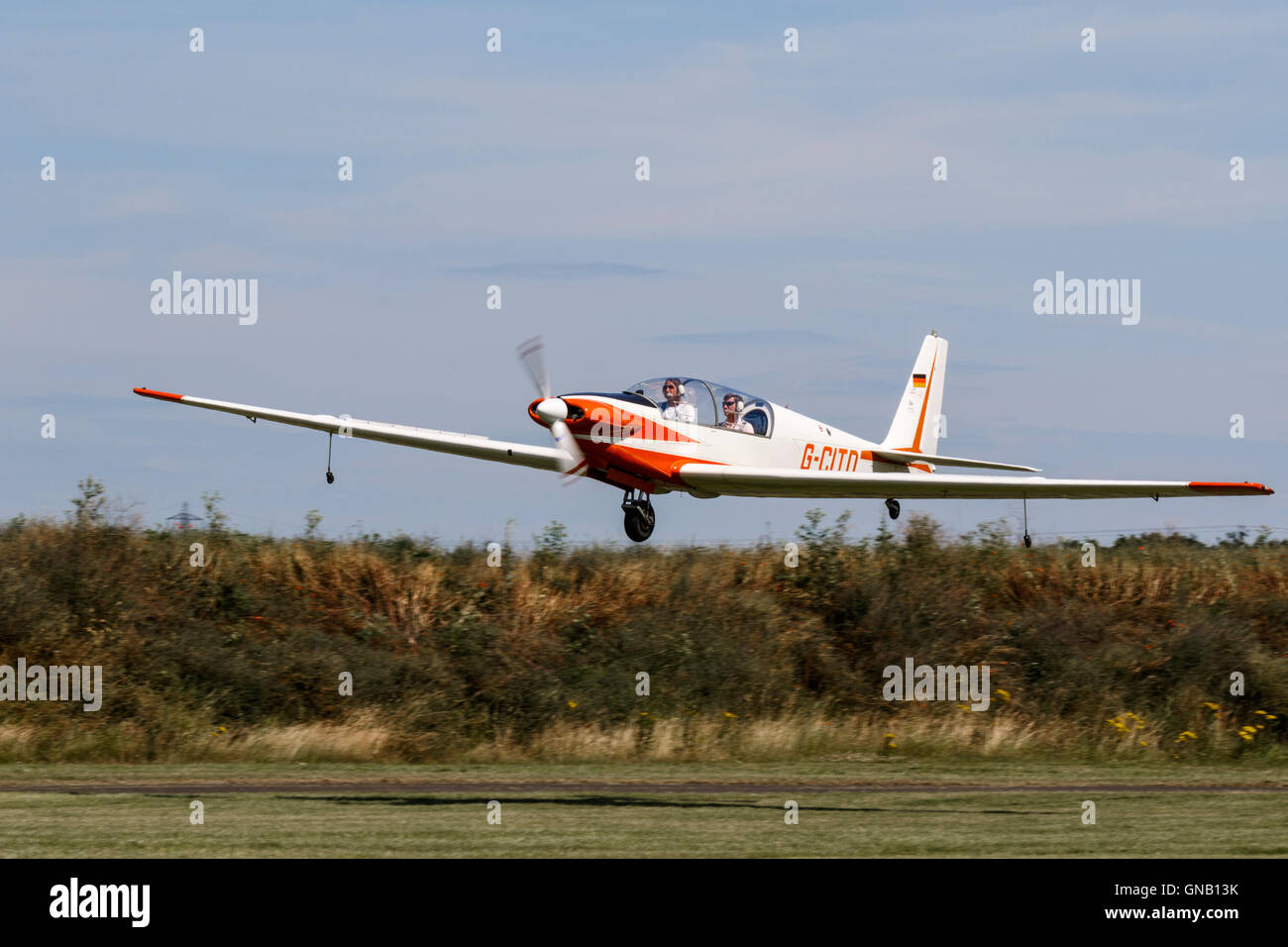 Fournier RF5 G-CITD in flight landing at Breighton Airfield Stock Photo
