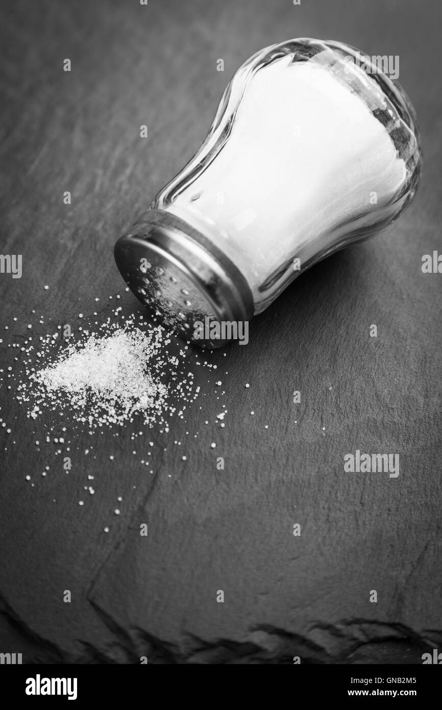 Salt shaker on slate board Stock Photo Alamy