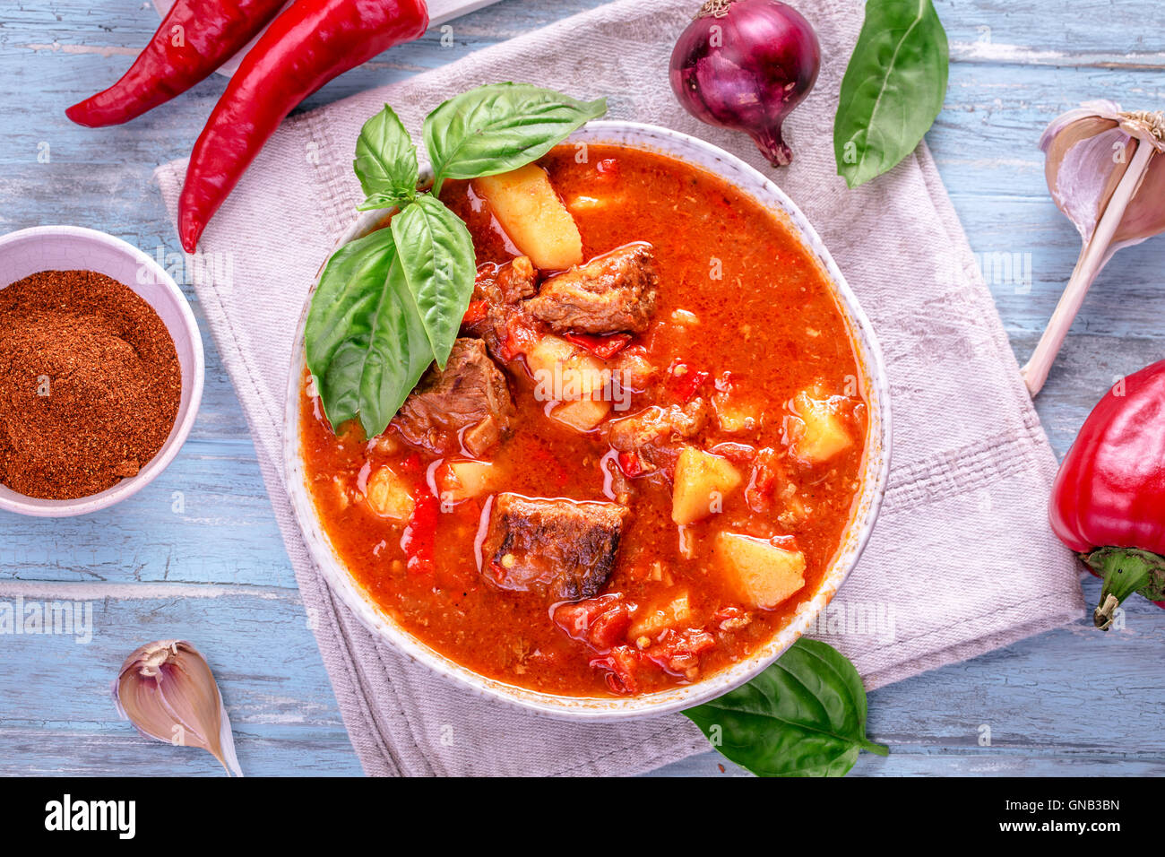 Hungarian goulash top view on cyan background Stock Photo