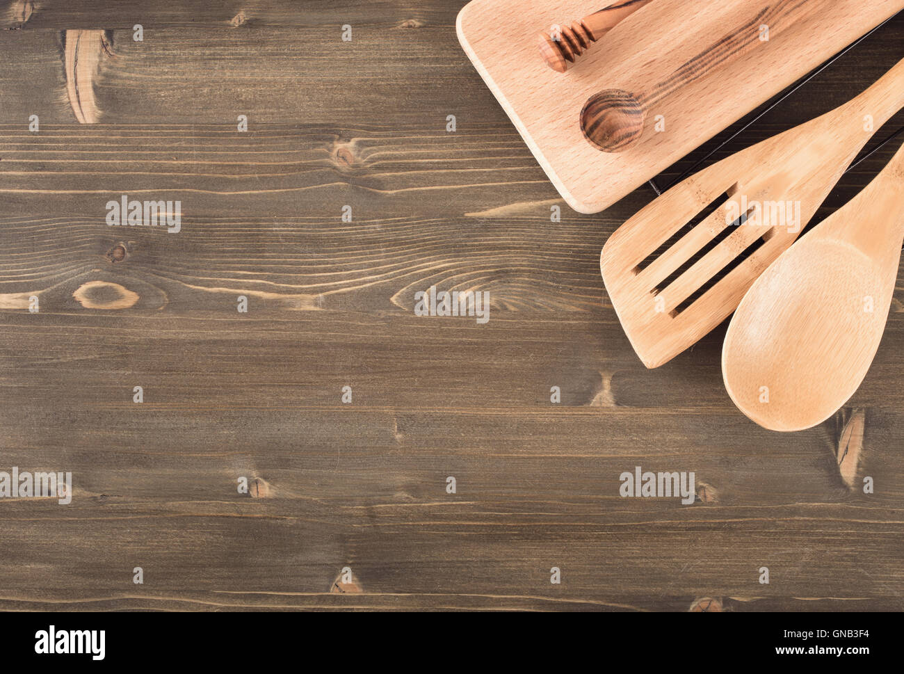 Kitchen utensils on wooden background Stock Photo