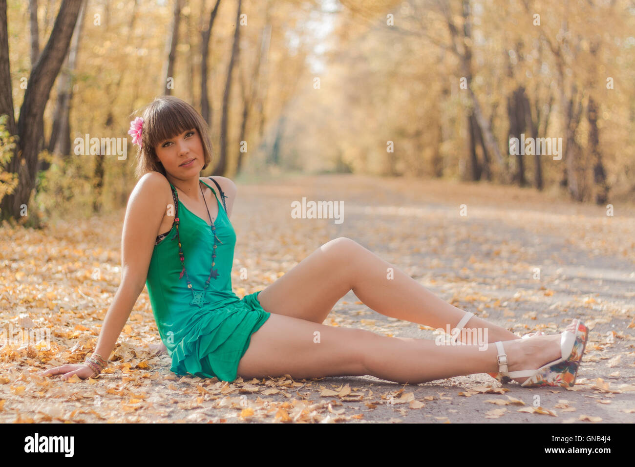Beautiful girl in autumn park Stock Photo - Alamy