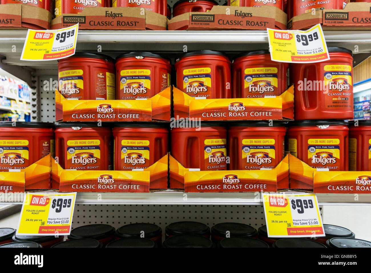 Tubs of Folgers Classic Roast Coffee for sale on supermarket shelves. The largest-selling ground coffee in the US Stock Photo