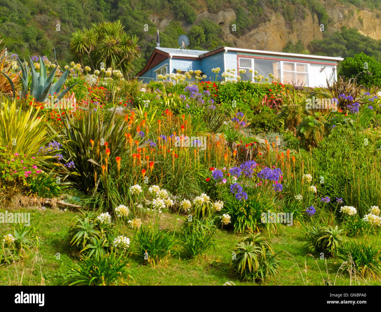 Rural dream house in lush flowering natural garden Stock Photo