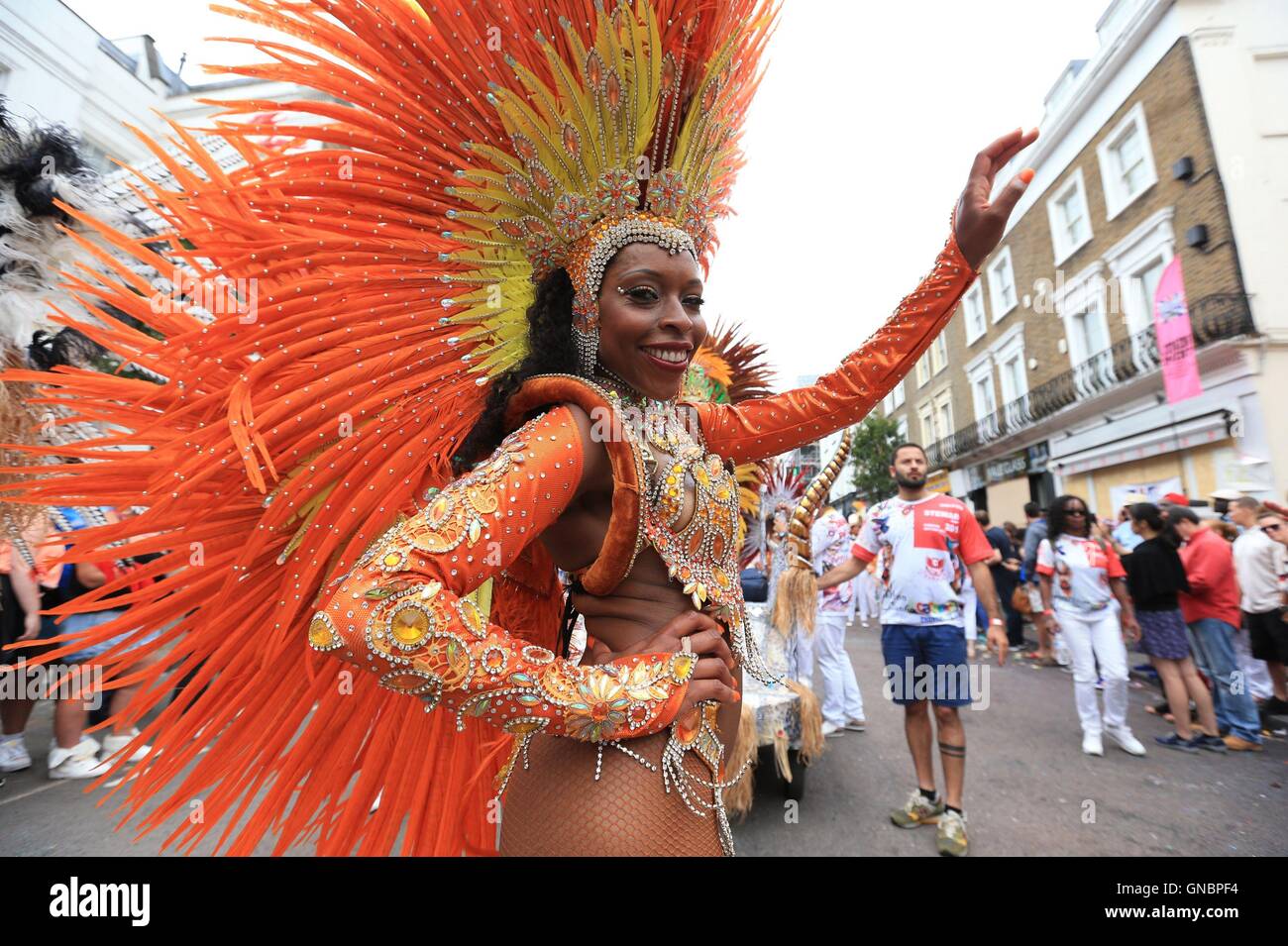 A samba dancer processes down Chepstow Road during the second and final day of the Notting Hill Carnival, west London. Stock Photo