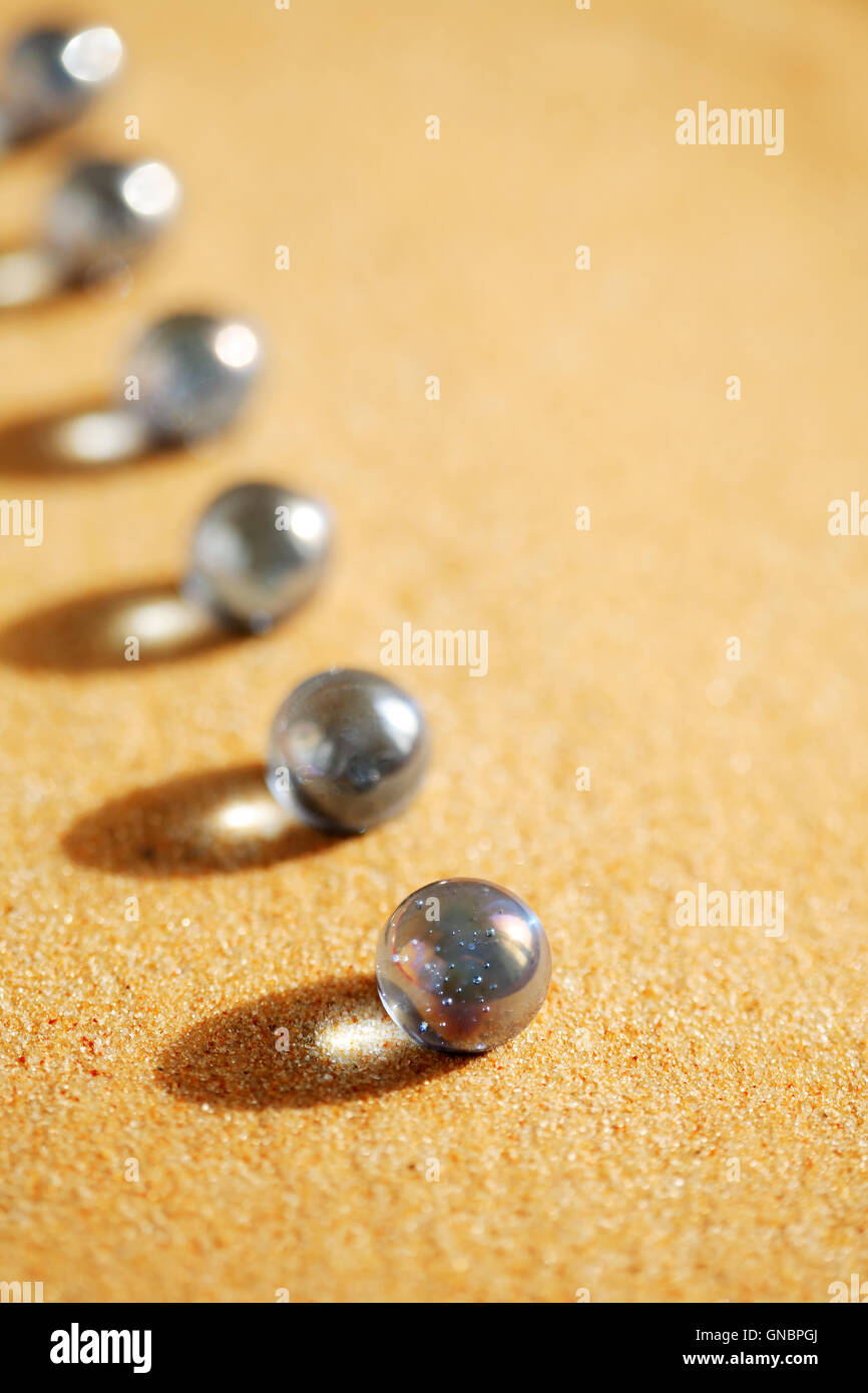 Glass Balls On Sand Stock Photo Alamy