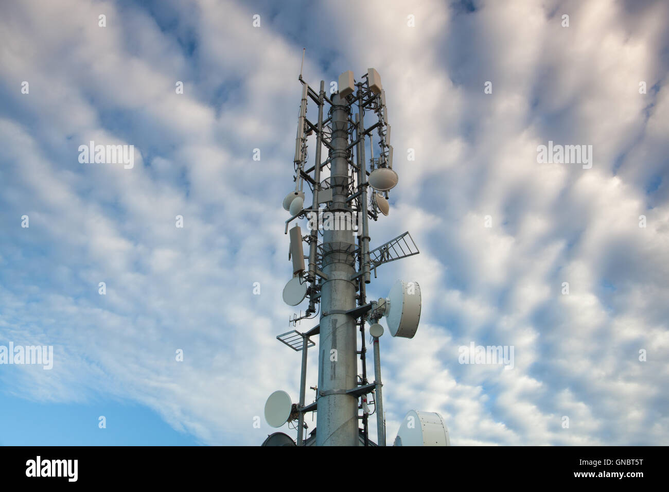 High Tech Sophisticated Electronic Communications Tower in the morning. Stock Photo