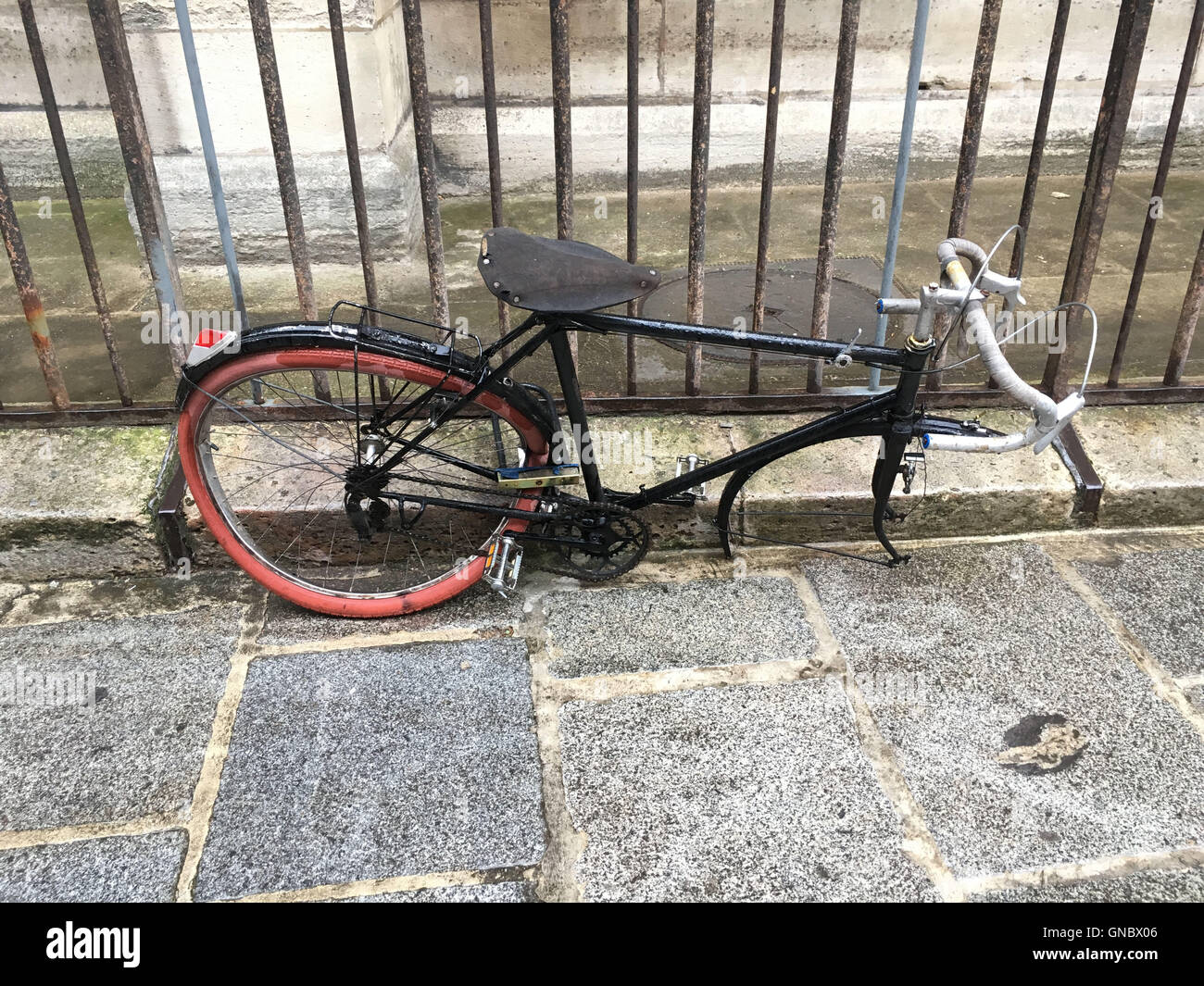 It's a photo of a abandoned Bicycle in the streets of Paris Stock Photo