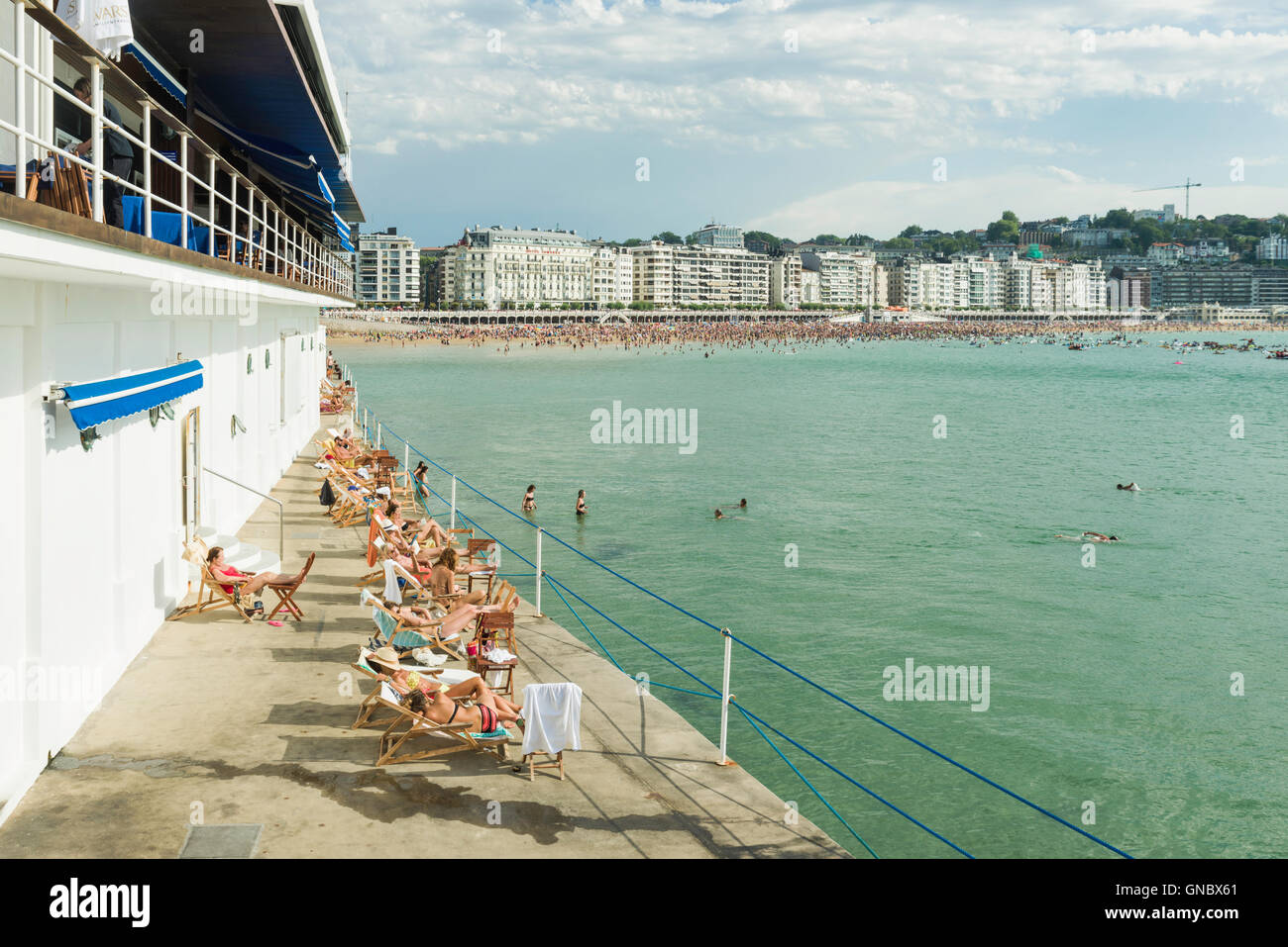 Sunbathers La Concha Bay San Sebastian Donostia Stock Photo