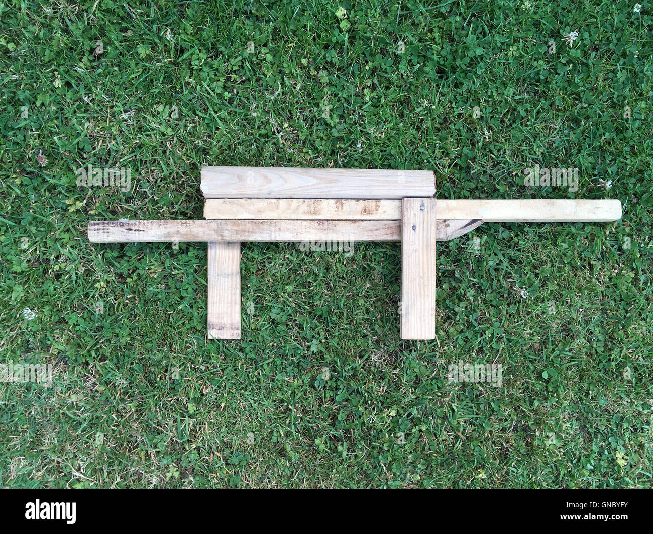 It's a photo of a Wood Weapon Toy homemade by kid Stock Photo