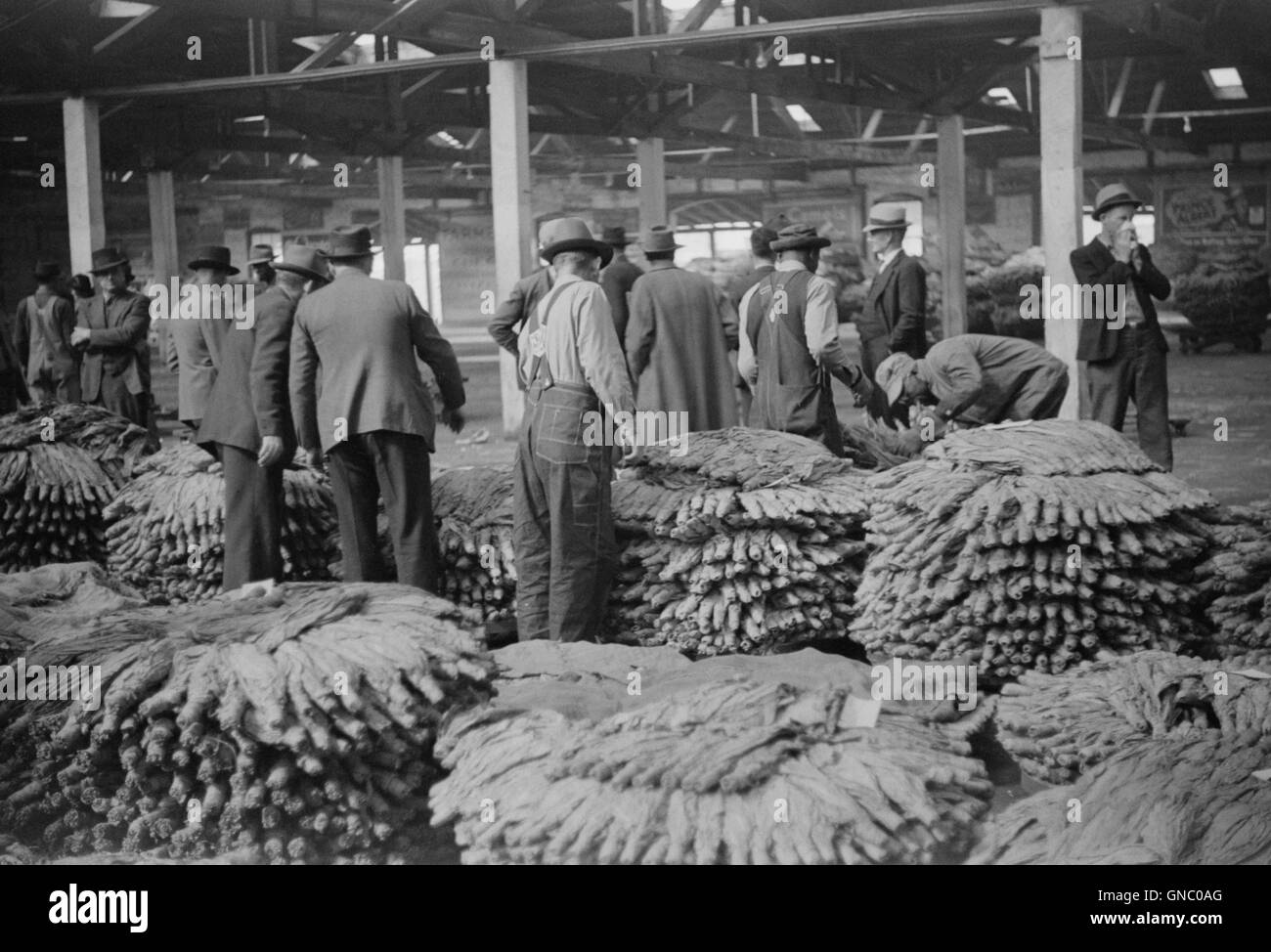 Farmers at Tobacco Auction, Durham, North Carolina, USA, Marion Post  Wolcott for Farm Security Administration, November 1939 Stock Photo