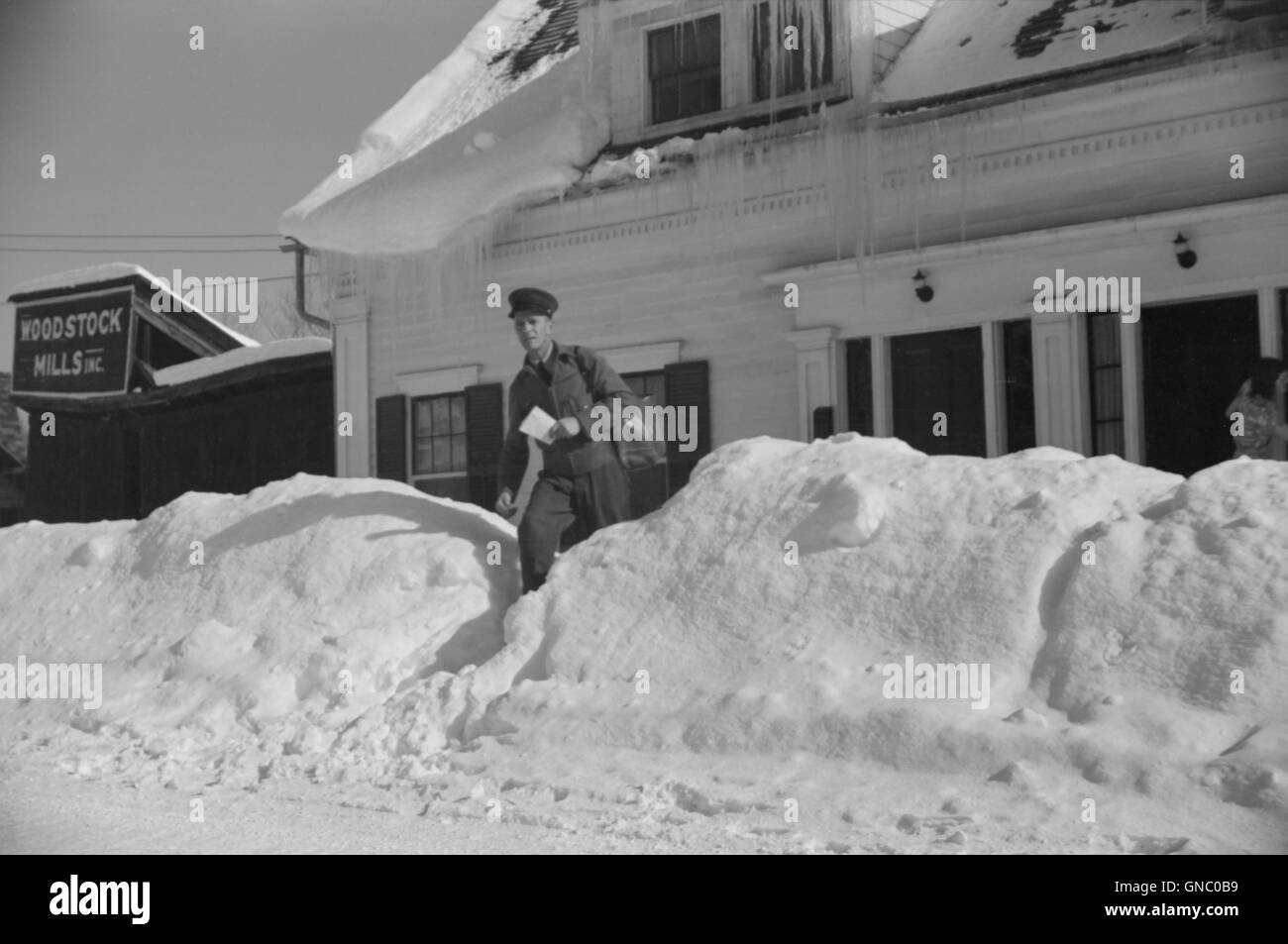 Mailman Delivering Mail after Heavy Snowfall, Woodstock, Vermont, USA, Marion Post Wolcott for Farm Security Administration, March 1940 Stock Photo