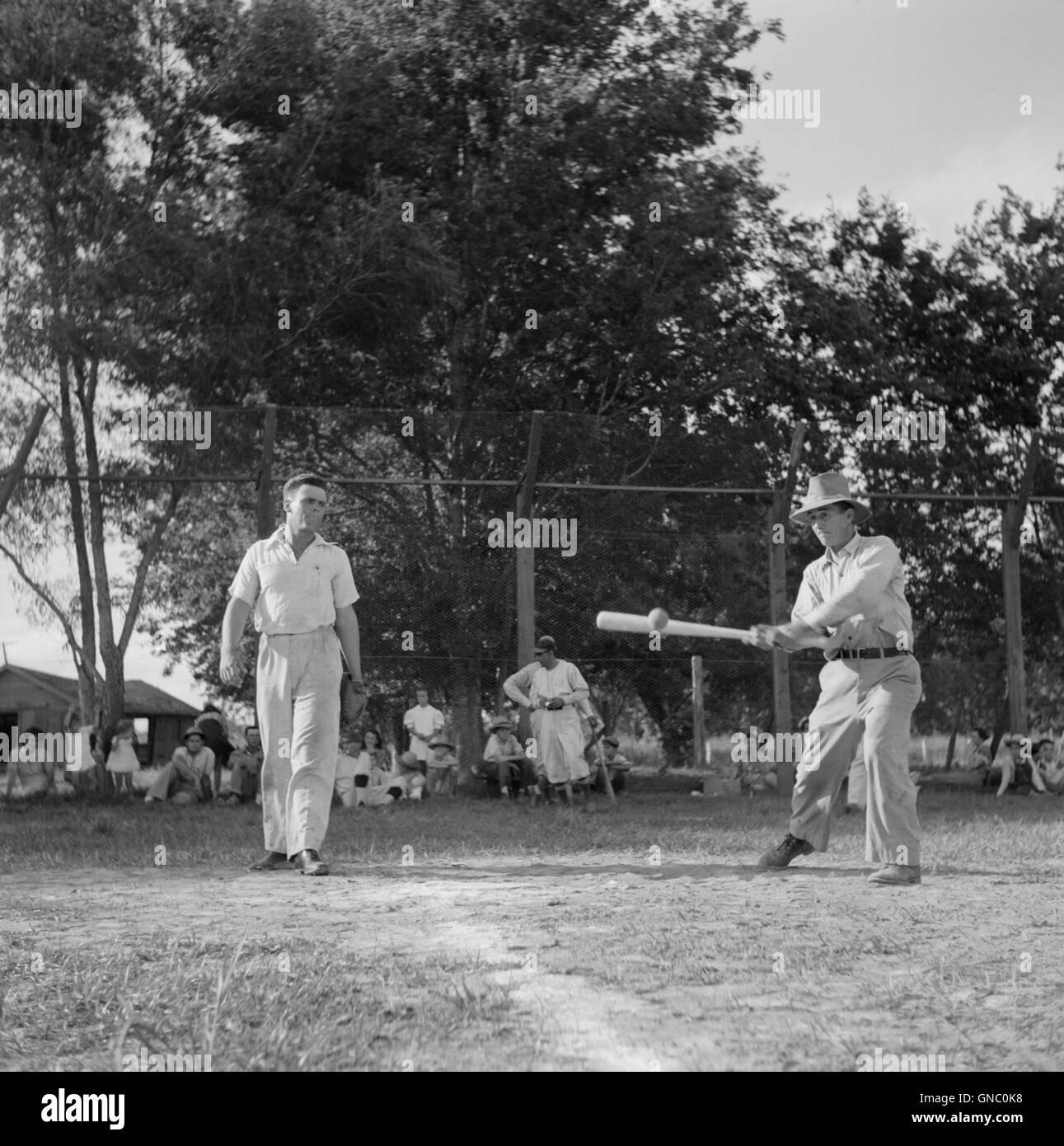 Men Playing Baseball on Saturday Afternoon, Schriever, Terrebonne Parish, Louisiana, USA, Marion Post Wolcott for Farm Security Administration, June 1940 Stock Photo