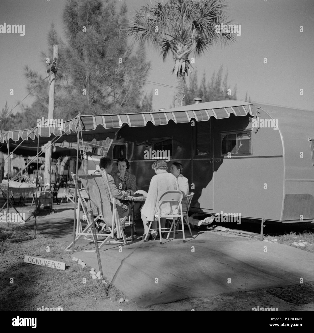 Women Playing Cards on Porch of Trailer Home, Sarasota, Florida, USA, Marion Post Wolcott, U.S. Farm Security Administration, January 1941 Stock Photo