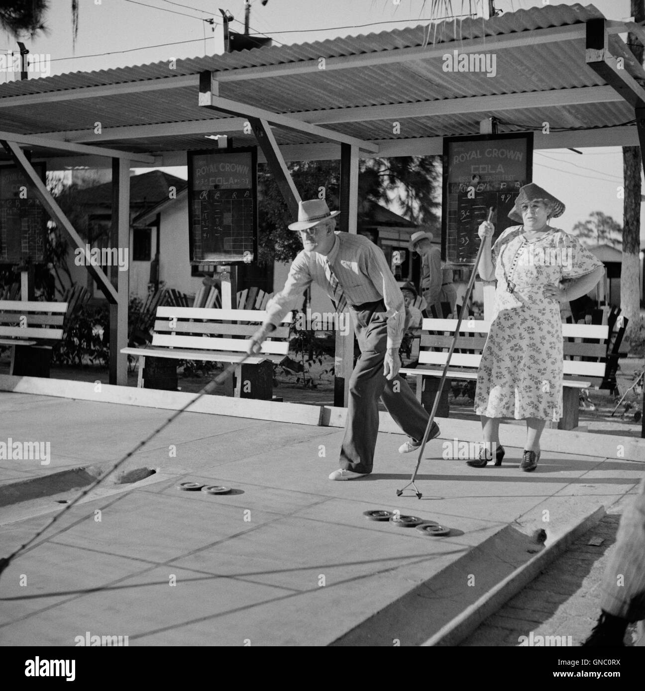 Elderly Couple Playing Shuffleboard, Sarasota Trailer Park, Sarasota, Florida, USA, Marion Post Wolcott, U.S. Farm Security Administration, January 1941 Stock Photo