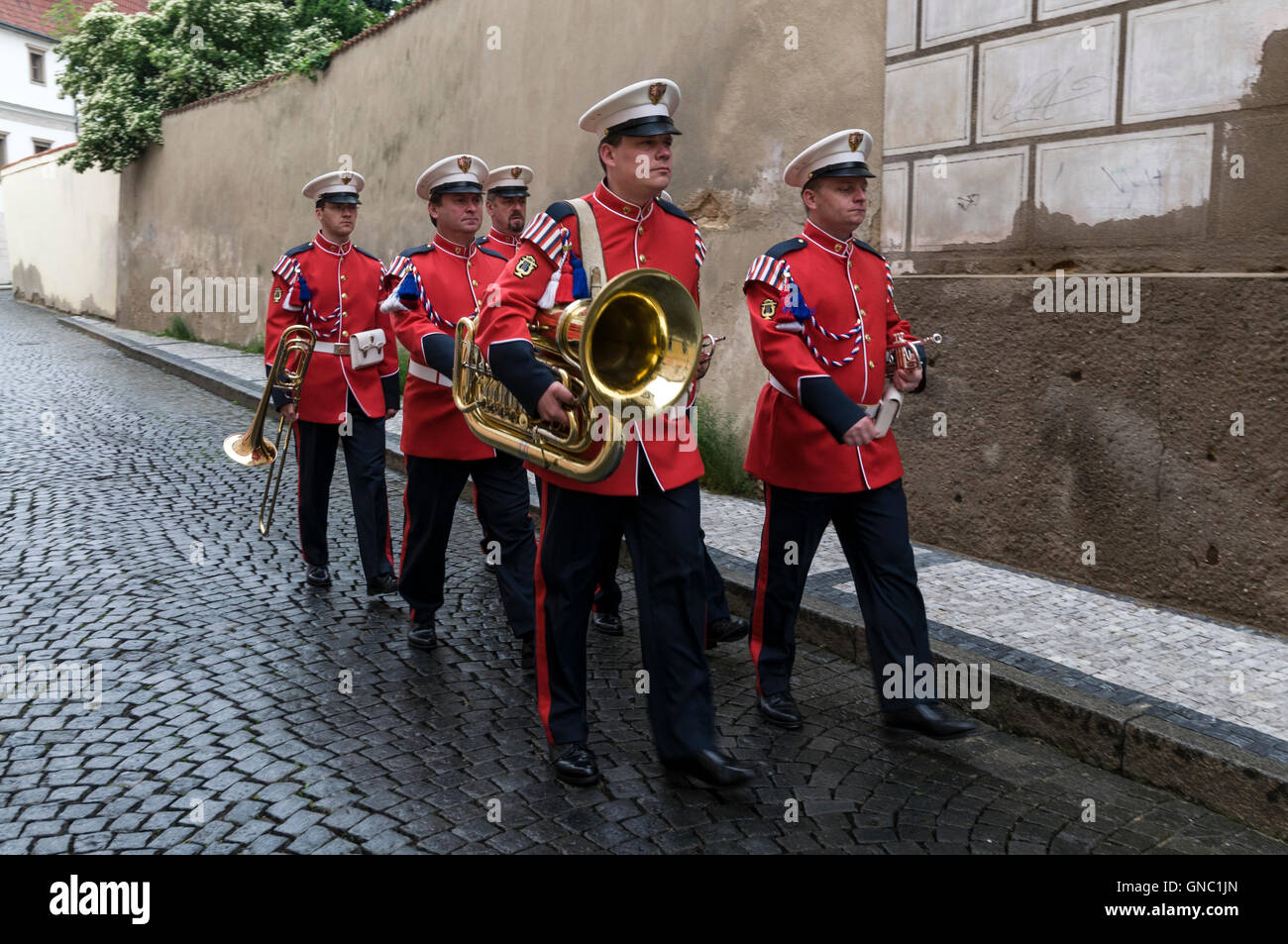 An army band of the Czech Presidential Guard marching towards Prague Castle in the Castle district of Prague in the Czech Republic Stock Photo