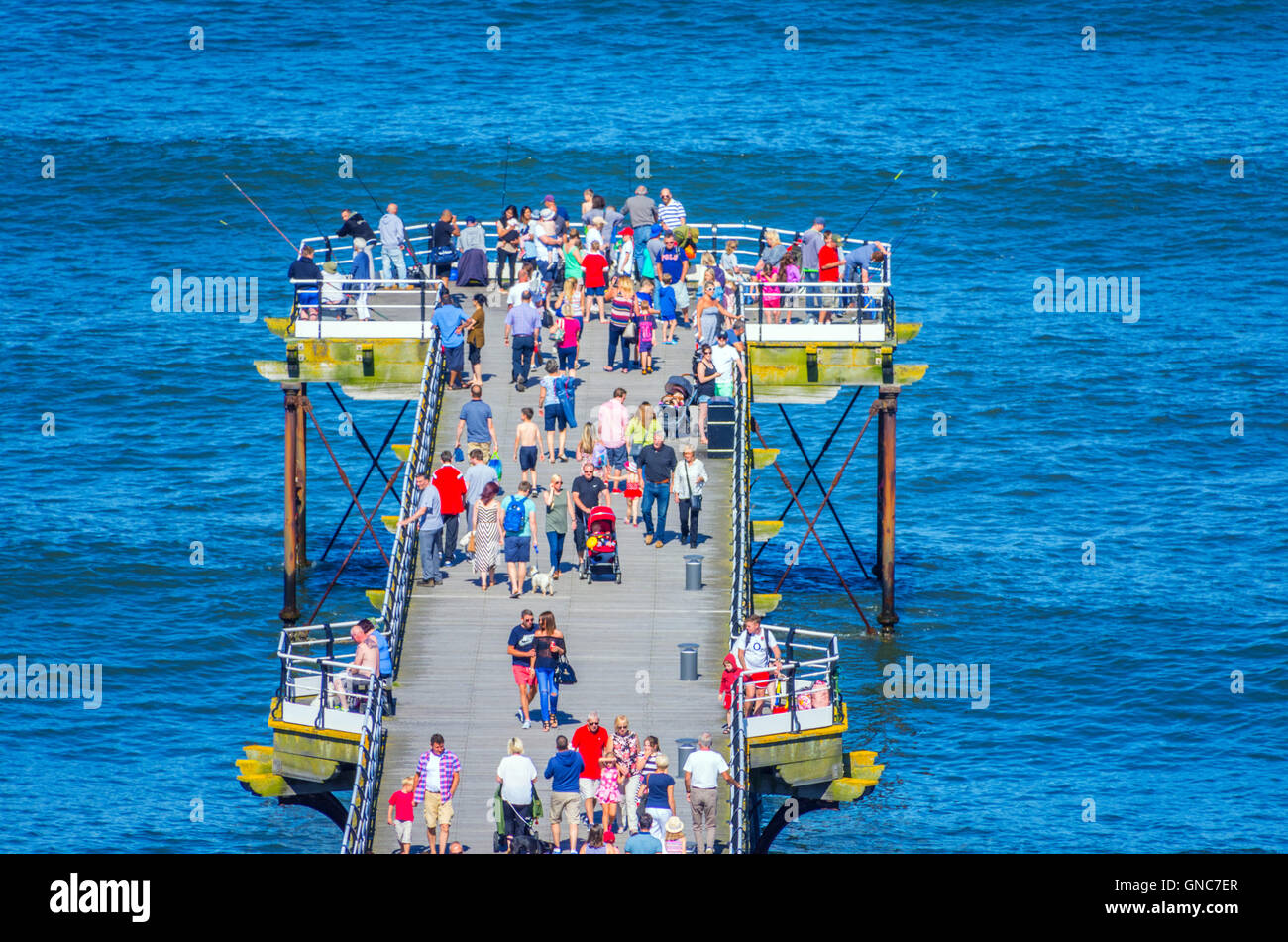 Crowds of people enjoying Saltburn Pier on a sunny Bank Holiday Stock Photo
