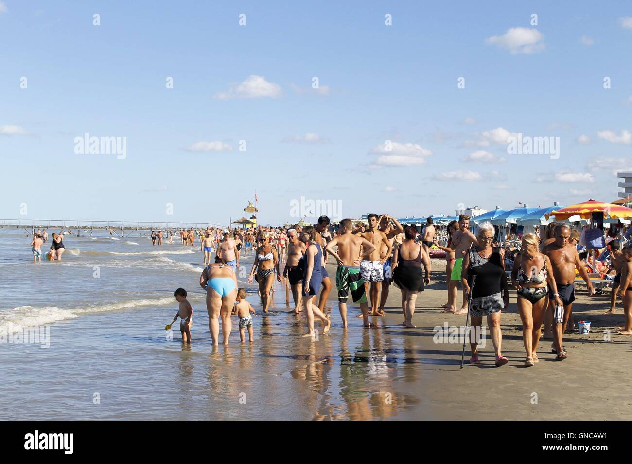 People strolling on the beach of Gatteo a mare in Romagna in Italy on Adriadico sea Stock Photo
