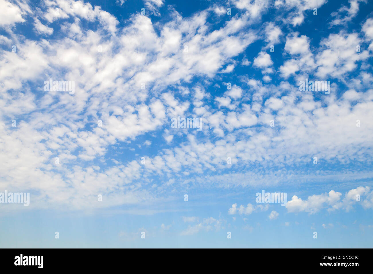 Natural blue sky with white altocumulus clouds, background photo texture Stock Photo