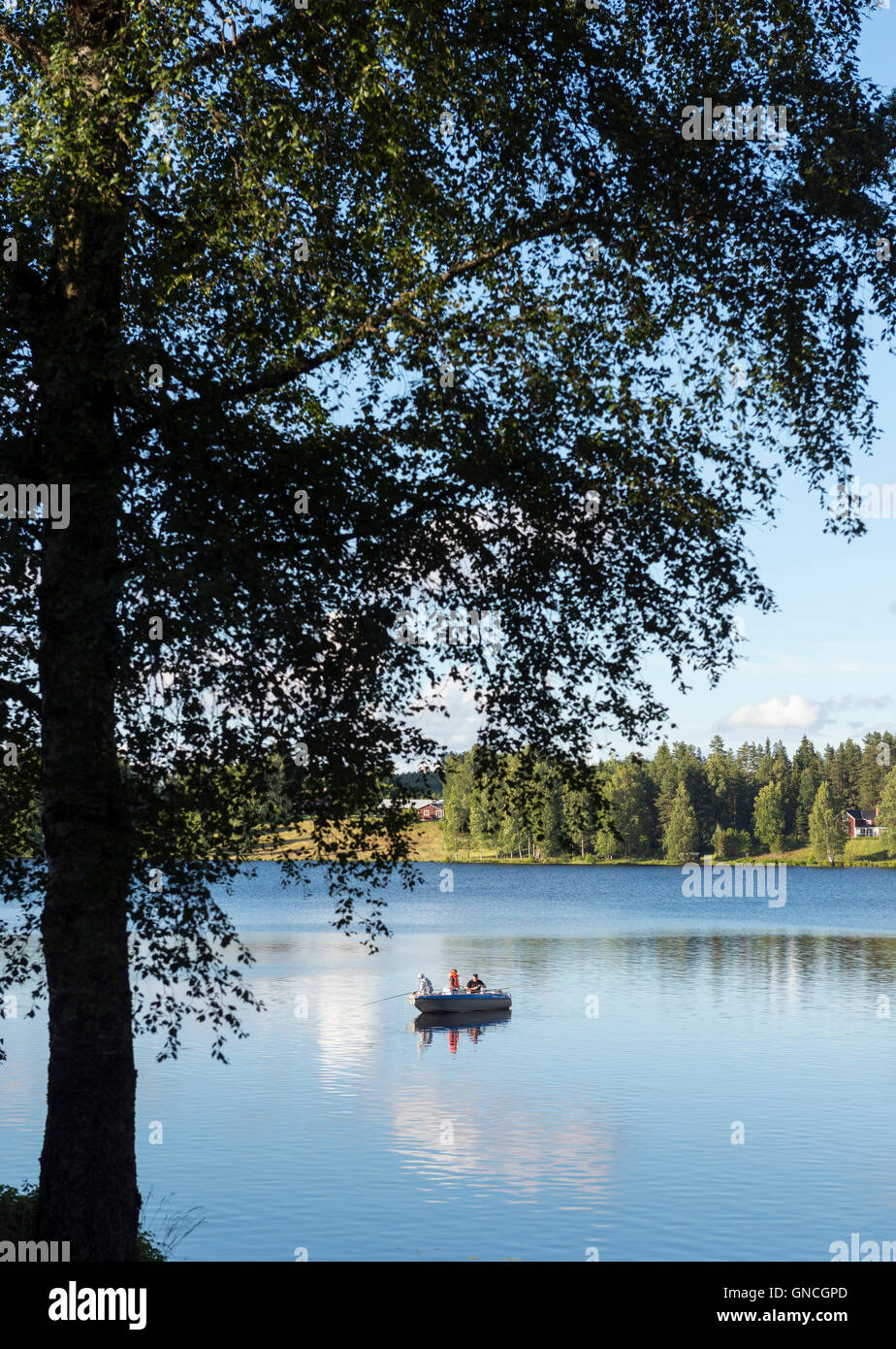 Fishing from boat, Sweden Stock Photo
