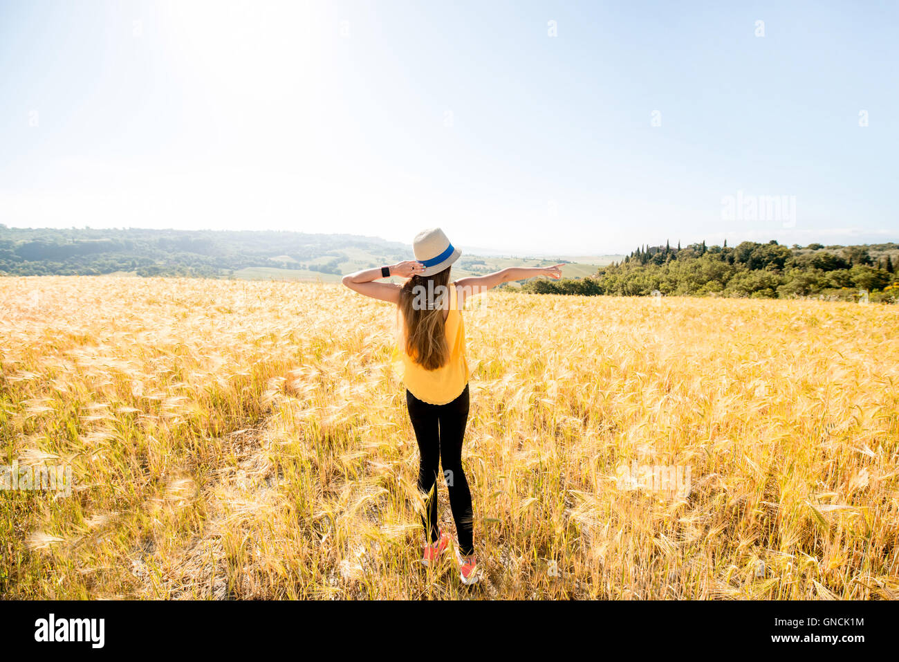 Woman in the wheat field Stock Photo - Alamy