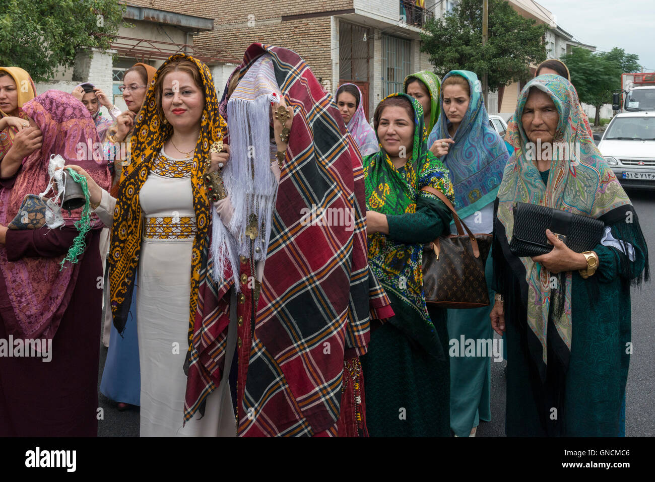 Bandar Torkaman, Turkmen Wedding, Bride Covered With Tratitional Veil Walking On The Street With Female Relatives Stock Photo