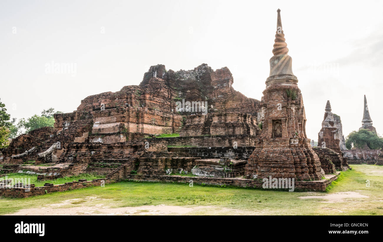 Ancient ruins of pagoda under sun light at Wat Phra Mahathat temple is a famous attractions in Phra Nakhon Si Ayutthaya Historic Stock Photo