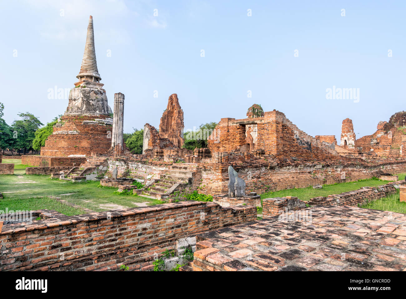 Ancient ruins of pagoda at Wat Phra Mahathat temple is a famous attractions in Phra Nakhon Si Ayutthaya Historical Park Stock Photo